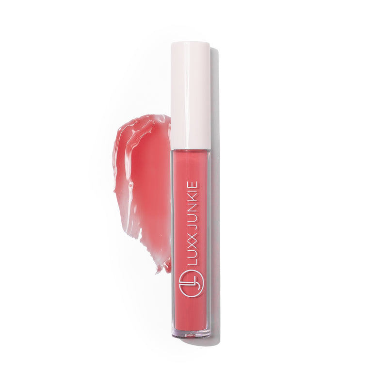 Flirt LUXX Lip Gloss: vegan sheer pink coconut-scented lip gloss with packaging